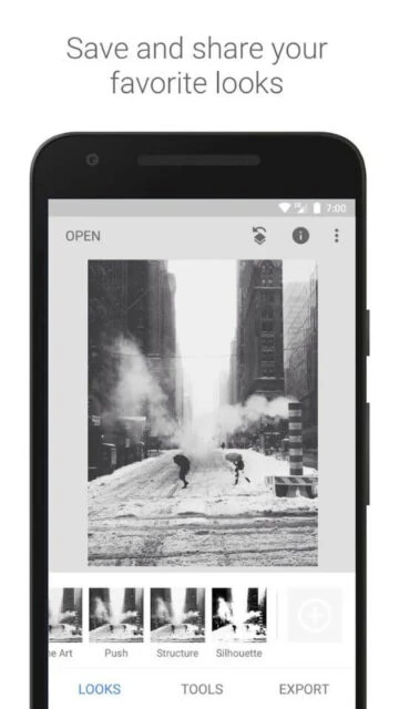 Snapseed app displaying black and white snow scene with filter options