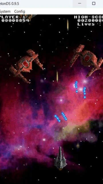 MelonDS running a space shooter game with player ship and enemy units on screen.